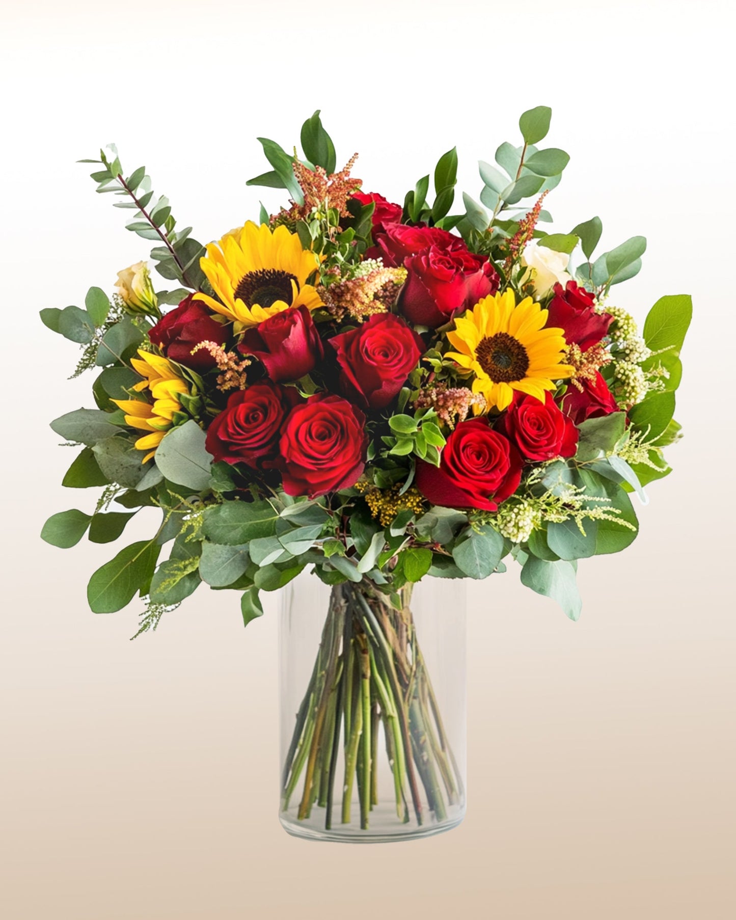 A bold bouquet of red roses and sunflowers. Vibrant, expressive, and full of warmth.
