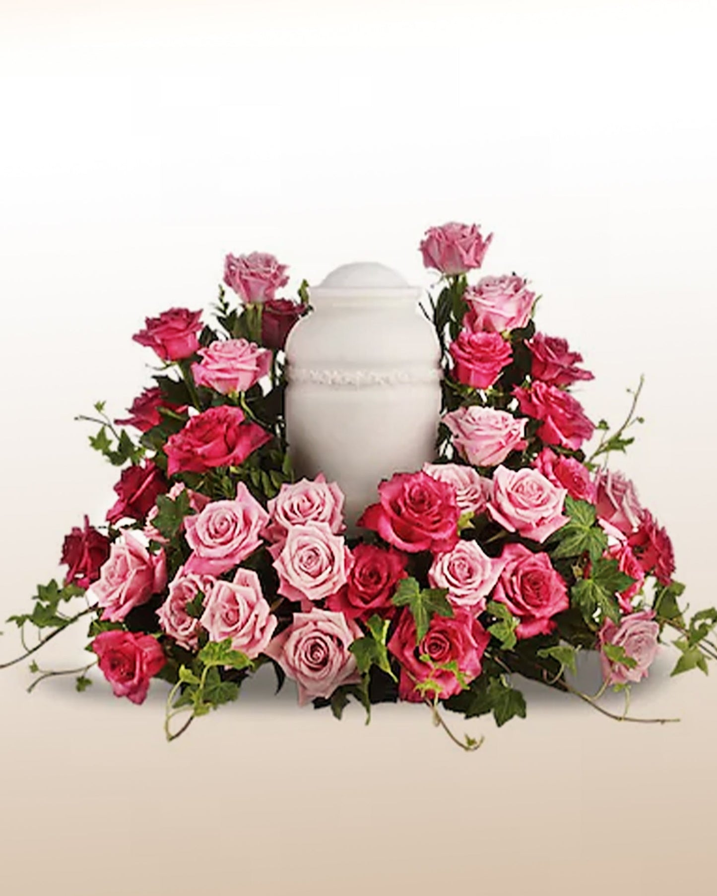 Memorial arrangement with pink and fuchsia roses designed to honor life and remembrance. Delivered across the USA.