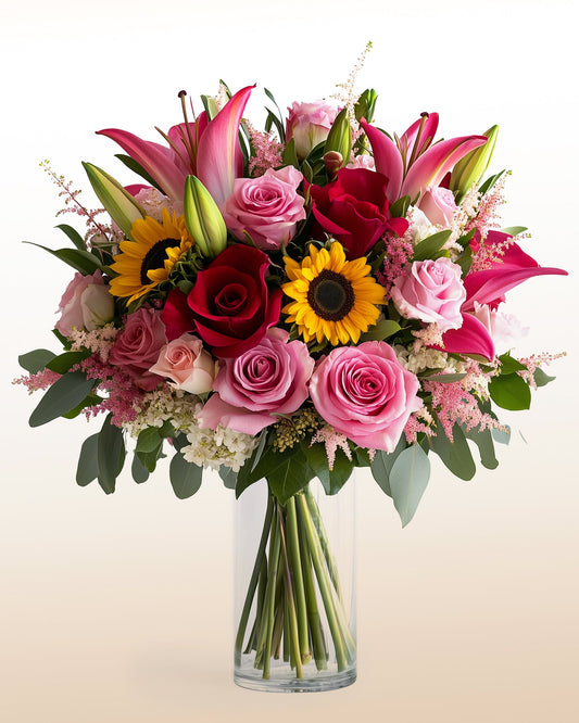 A powerful mixed arrangement featuring roses, sunflowers, lilies, and seasonal blooms. Bold, modern, and designed to make an impact.