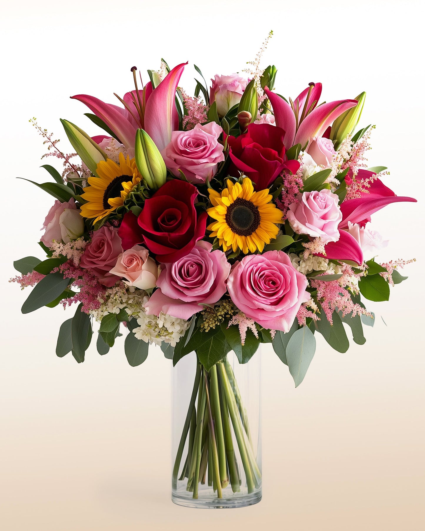 A powerful mixed arrangement featuring roses, sunflowers, lilies, and seasonal blooms. Bold, modern, and designed to make an impact.
