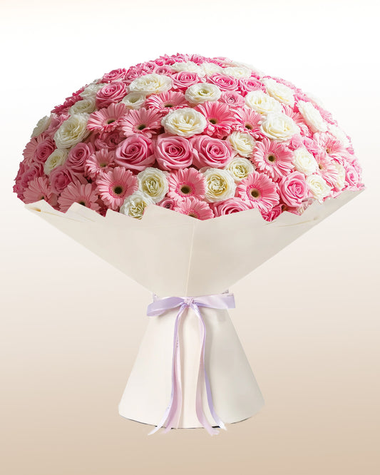 A grand luxury arrangement featuring roses and gerberas. Refined, expressive, and handcrafted.