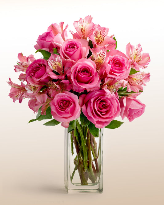 A bold and modern bouquet in vivid fuchsia tones featuring roses and alstroemeria. Expressive, bright, and handcrafted.