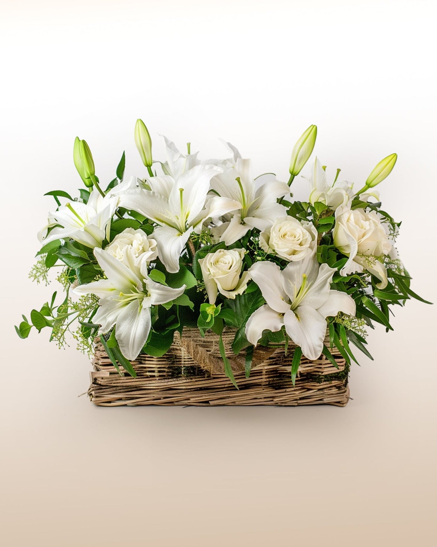A serene sympathy arrangement with white lilies and roses, designed to express comfort, peace, and remembrance. USA delivery.