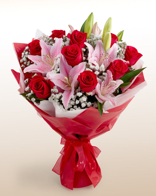 An elegant bouquet of roses and lilies crafted with premium blooms. Refined, fresh, and perfect for meaningful gifting.