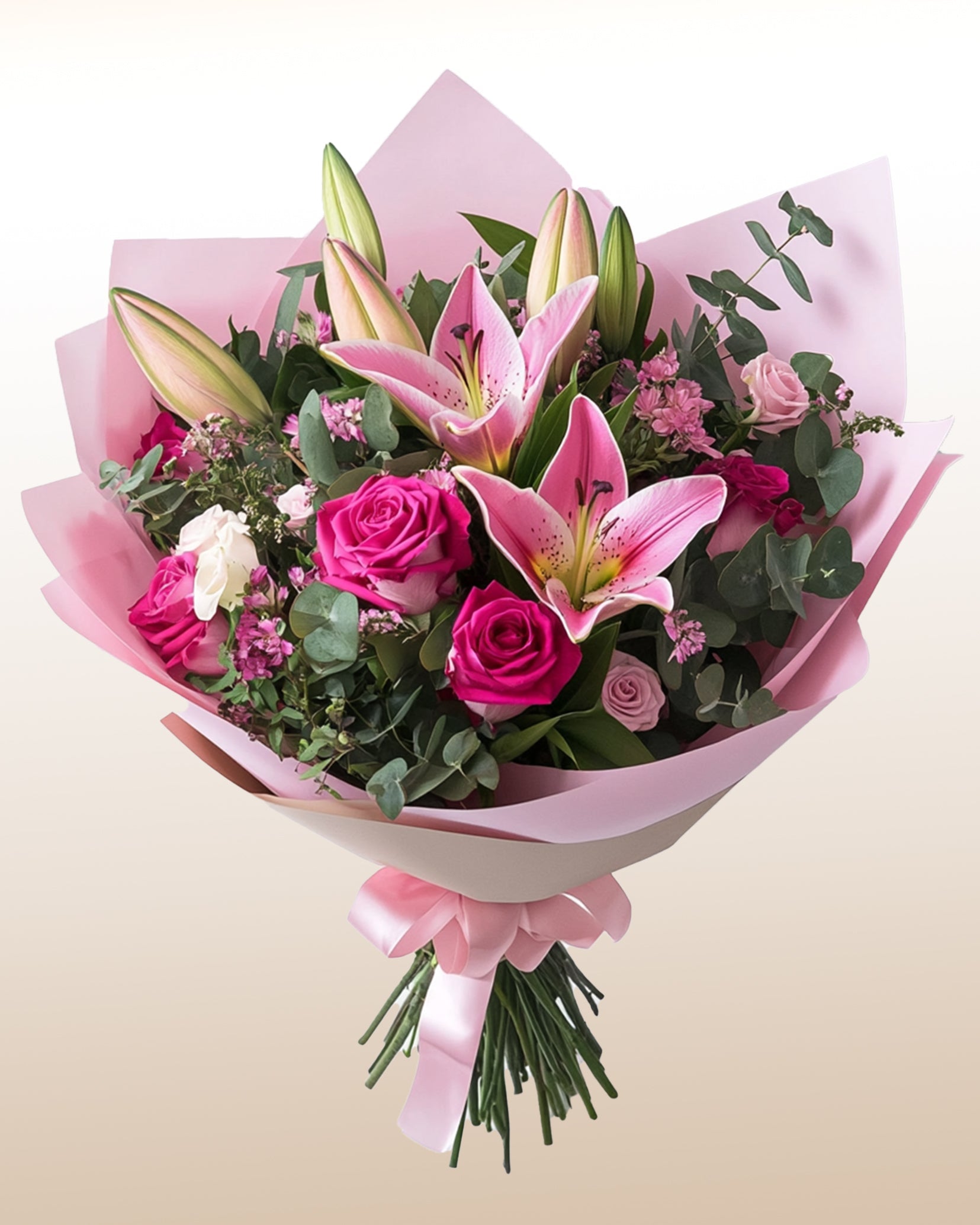 A refined bouquet of pink lilies, roses, and seasonal florals. Soft, elegant, and sincerely expressive.