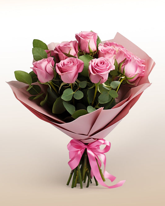 Send 12 pink roses arranged in a modern, elegant style. A soft and expressive bouquet delivered worldwide by trusted local florists.