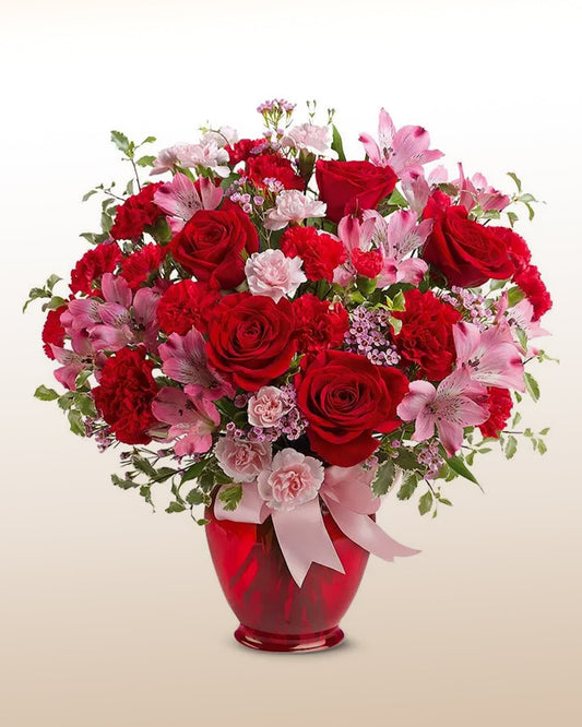 A striking bouquet of red roses with romantic accents. Passionate, bold, and handcrafted.