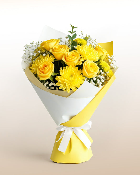 A radiant bouquet of yellow flowers and seasonal blooms. Fresh, joyful, and full of sunshine.
