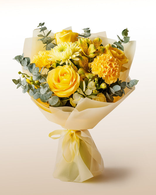 A joyful bouquet of yellow roses and blooms. Bright, optimistic, and handcrafted.