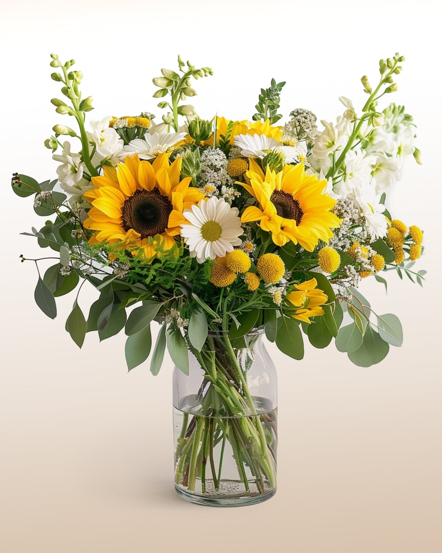 A bright arrangement of sunflowers and seasonal blooms designed in a modern, uplifting style. Delivered worldwide by trusted local florists.